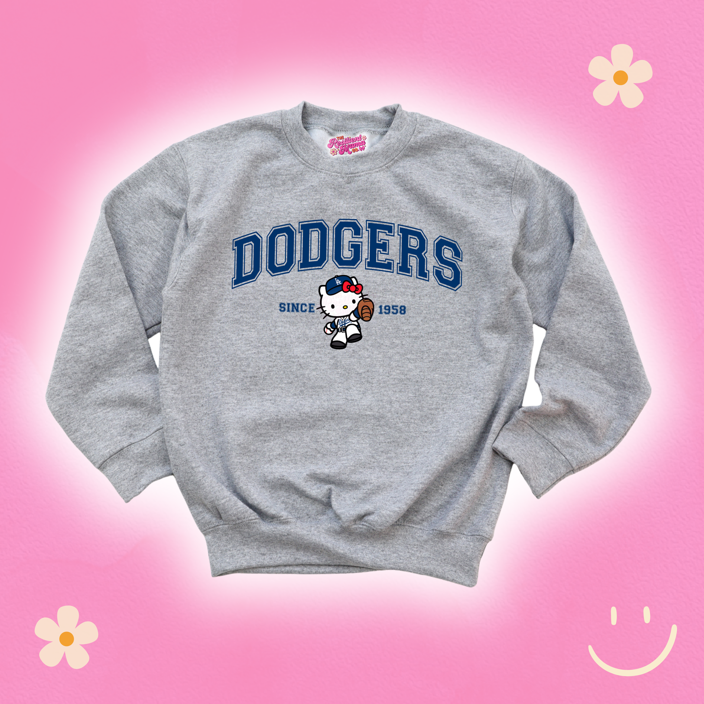 Gray sweatshirt with 'Dodgers' and cartoon character on a pink background