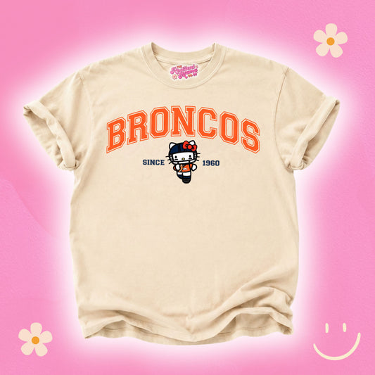 Hello Kitty football graphic T-shirt featuring a cute game day design, perfect for football season and Hello Kitty fans.