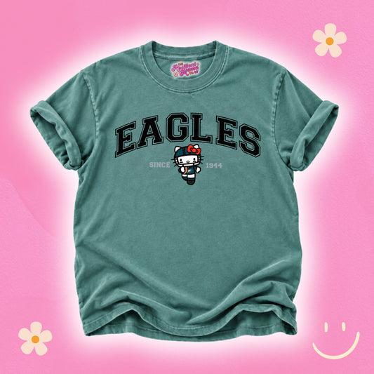 Hello Kitty football graphic T-shirt featuring a cute game day design, perfect for football season and Hello Kitty fans.